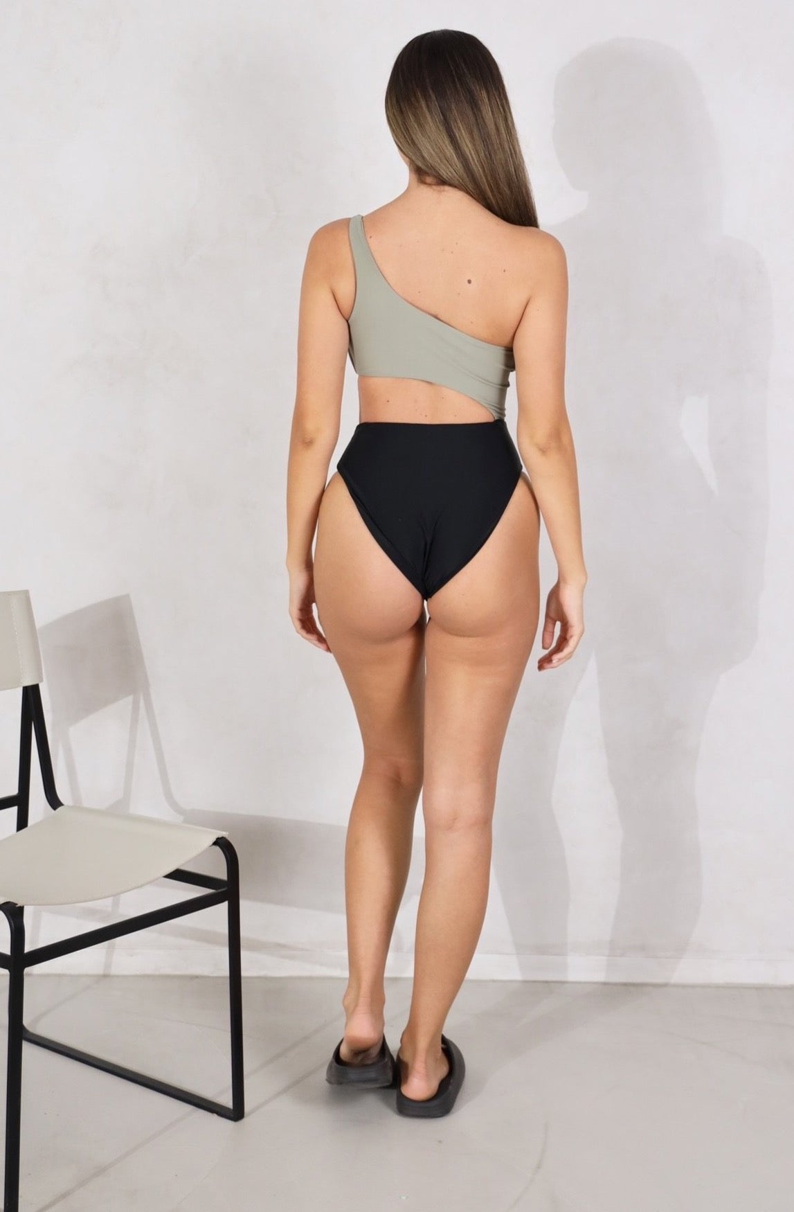 Shop our women's one piece, one shoulder strap swimsuit with a side open cut. Cheeky to medium coverage. Removable padding. Women's one piece swimsuits.High waist swimsuit. Women's Bikinis and swimsuits.Women's swimsuits. Khaki and Black bikinis & swimsuits. Khaki & Black Bathers. Multi colour swimsuit. Free Shipping on Australian Orders over $100. Free Shipping to New Zealand on orders over $180. Shipping Worldwide.