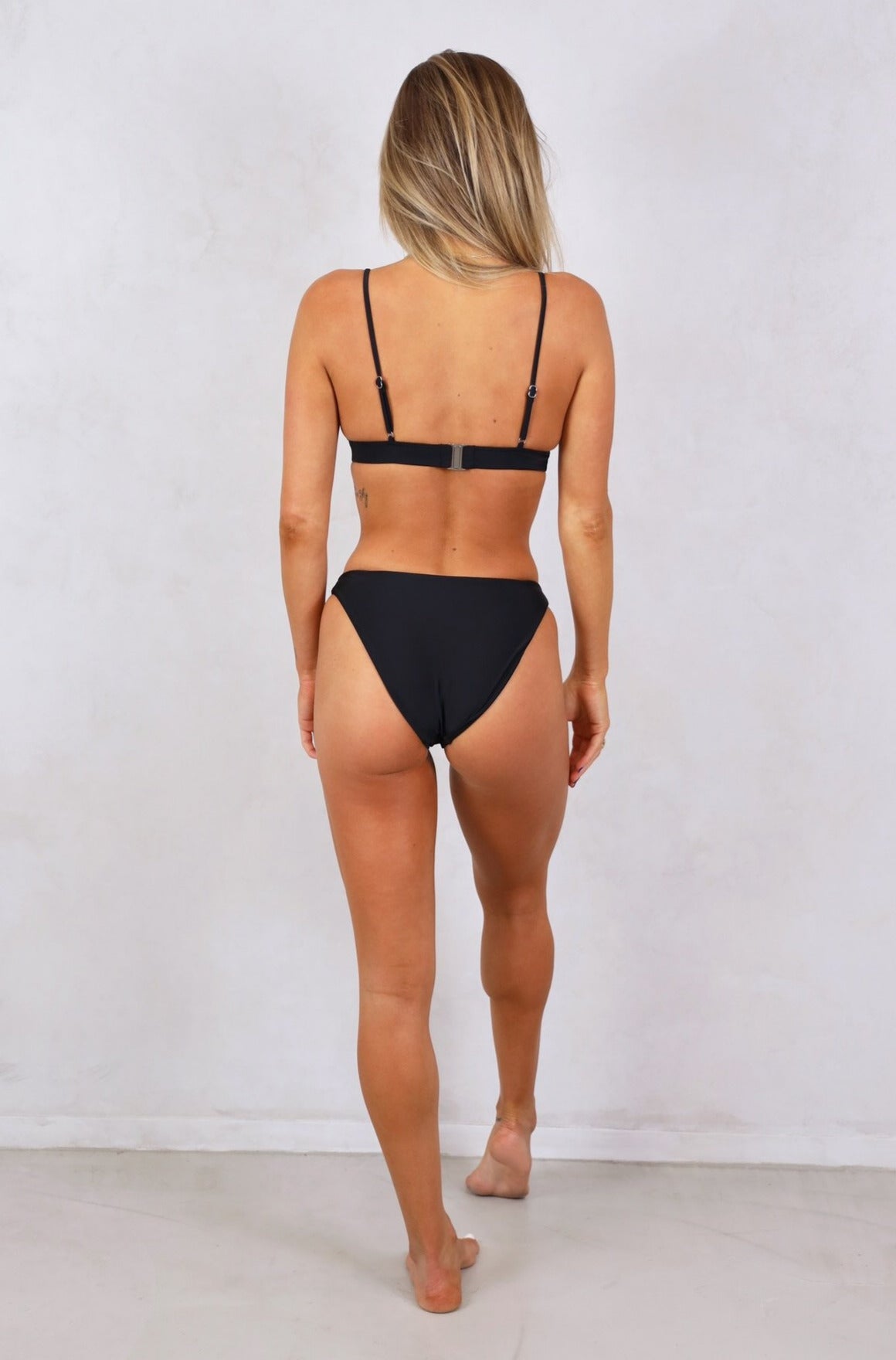 Shop all the latest Esencial Swim swimwear styles, One Piece Swimsuits, ribbed and minimal tan line Brazilian bikini's.For the comfort of your body and curves, buy seamless black bikini bottoms. Women's black high cut high waist bikini bottoms. Medium coverage bikini's. Black Women's Swimwear. Matching adjustable strap with removable padding bikini top available. Free Shipping on Australian Orders over $100.