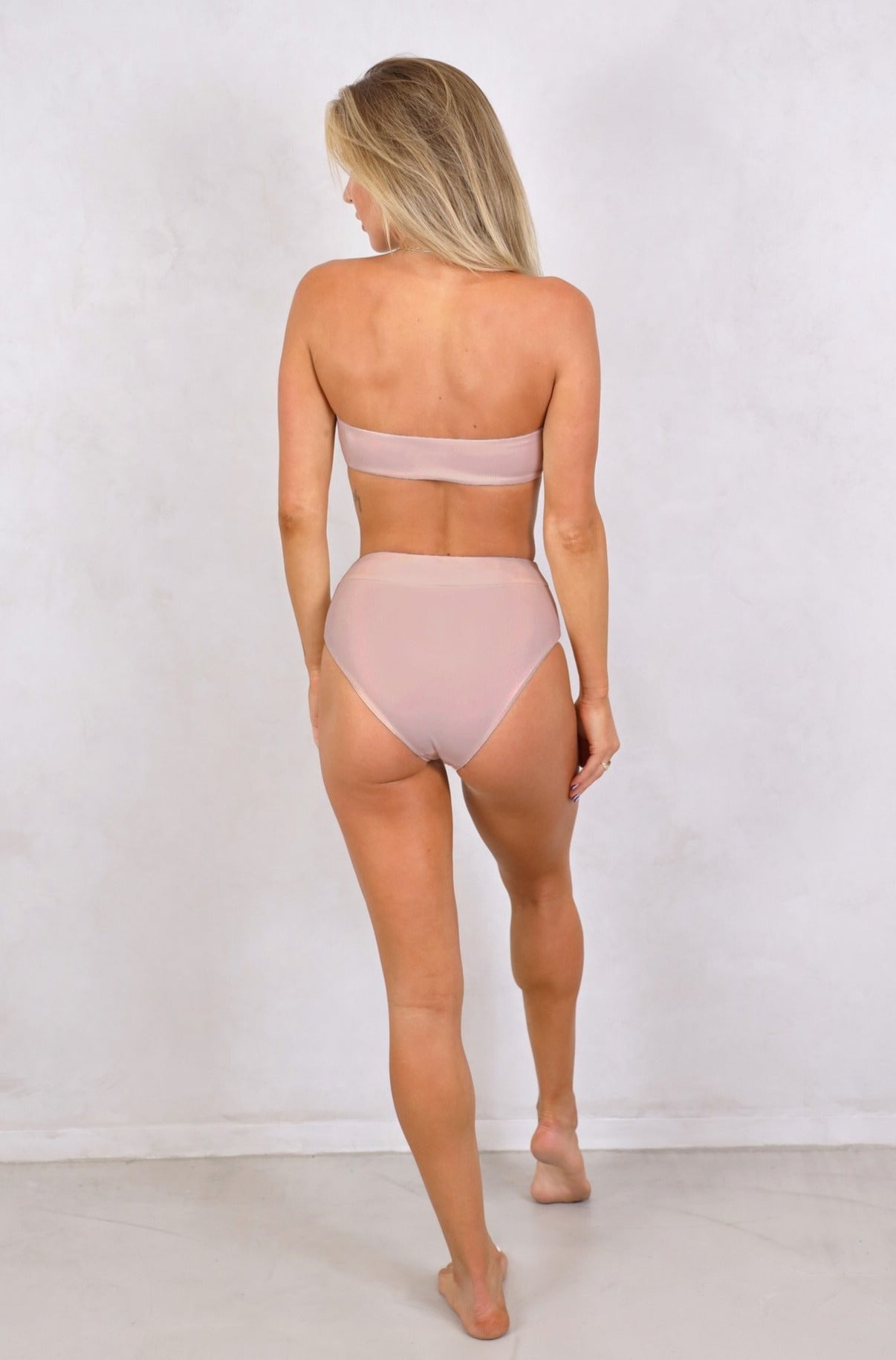 Shop ribbed strapless bandeau swimwear tops with removable front tie up knot. Women's Swimwear.Blush ribbed swimwear. Blush bikini. Strapless Bandeau with removable padding. Women's Bikinis and swimsuits. Free Shipping on Australian Orders over $100. Free Shipping to New Zealand on orders over $180. Shipping Worldwide.