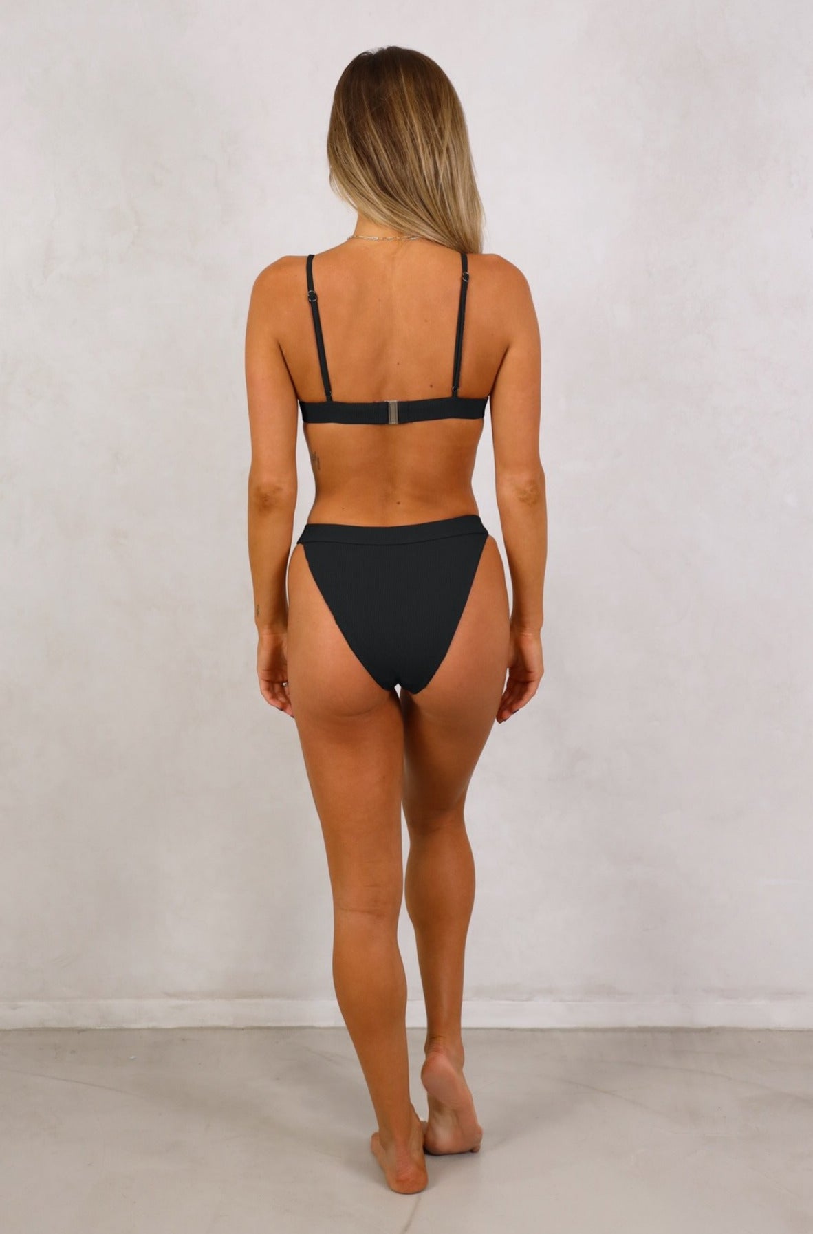 Shop Esencial Swim ribbed high cut high waist bikini sets. Our ribbed swimwear are known for their function and durability. Matching ribbed bikini tops with adjustable straps available. Women's black ribbed swimwear. Shop Women's Swimwear. Women's Bikinis and swimsuits. Free Shipping on any Australian Order over $100. Free Shipping to New Zealand on orders over $180. Afterpay Available. Shipping Worldwide.