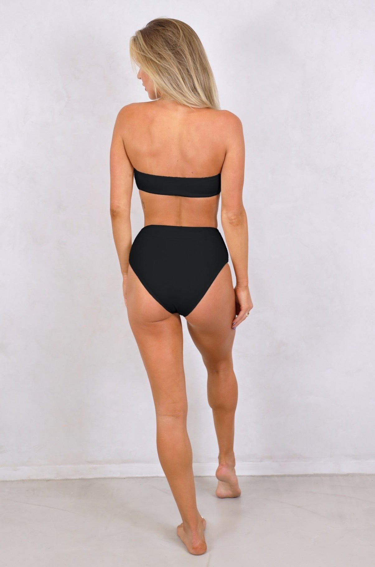 Shop ribbed strapless bandeau with removable front tie up knot Swimwear. Women's Swimwear.Black ribbed swimwear.Strapless Bandeau with removable padding. Women's Bikinis and swimsuits. Free Shipping on any Australian Order over $100. Free Shipping to New Zealand on orders over $180. Shipping Worldwide. Alessia Top Black Strapless Bandeau Removable Front Tie up Knot Removable Padding Seamless Stitching.Fabric: Ribbed / Easy to care / Stretchy / 87% Nylon / 13% Spandex